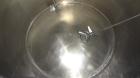 Used Mueller Tank, 1000 Gallon, 316 Stainless Steel, Vertical. Approximate 76” diameter x 57” straight side, open top with (2) covers, sloped bottom. (2) Lightnin clamp on agitators. (1) Model XJ-65V...