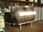 Used- Tank, 1200 gallon, stainless steel, horizontal. Approximately 66