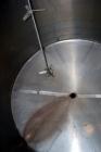 Used Tank, 2000 Gallon, 304 Stainless Steel Vertical. 84” Diameter x 80” straight side. Dished top, coned bottom. Off center top entering Lightnin air operated agitator, model XJAC-100. 1-1/2” Diamet...
