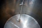 Used Tank, 2000 Gallon, 304 Stainless Steel Vertical. 84” Diameter x 80” straight side. Dished top, coned bottom. Off center top entering Lightnin air operated agitator, model XJAC-100. 1-1/2” Diamet...