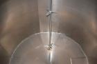 Used Tank, 2000 Gallon, 304 Stainless Steel Vertical. 84” Diameter x 80” straight side. Dished top, coned bottom. Off center top entering Lightnin air operated agitator, model N33AG-100. 1-1/2” Diame...