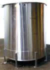 Used Tank, 1000 Gallon, 316 Stainless Steel, Vertical. Approximate 68’’ diameter x 70’’ straight side. Open top with a 1 piece hinged cover, flat bottom. Approximate 2’’ center bottom outlet. Mounted...