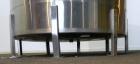 Used Tank, 1000 Gallon, 316 Stainless Steel, Vertical. Approximate 68’’ diameter x 70’’ straight side. Open top with a 1 piece hinged cover, flat bottom. Approximate 2’’ center bottom outlet. Mounted...