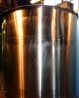Used Tank, 1,200 Gallon, Stainless Steel, Vertical. Open top with lids, dished bottom. Side mounted level gauge and bridge mounted 1 hp agitator.  1-1/2’’ Center bottom outlet.  Mounted on (4) stainl...