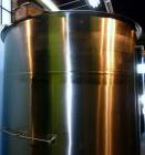Used Tank, 1,200 Gallon, Stainless Steel, Vertical. Open top with lids, dished bottom. Side mounted level gauge and bridge mounted 1 hp agitator.  1-1/2’’ Center bottom outlet.  Mounted on (4) stainl...