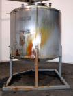 Used Tank, 1650 Gallon, 316 Stainless Steel, Vertical. Approximate 84” diameter x 60” straight side, dished top and bottom. Openings top 2” tri-clamp, (4) 3” tri-clamp, 2-1/2” tri-clamp, 23” man way ...