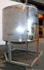 Used Tank, 1650 Gallon, 316 Stainless Steel, Vertical. Approximate 84” diameter x 60” straight side, dished top and bottom. Openings top 2” tri-clamp, (4) 3” tri-clamp, 2-1/2” tri-clamp, 23” man way ...