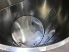 Used Tank, 1000 Gallon, 304 Stainless Steel, Vertical. Approximate 61” diameter x 81” straight side, flat top with a bolt on cover with a 1/3 hinged opening, sloped bottom. Side bottom entering agita...