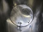 Used Tank, 1000 Gallon, 304 Stainless Steel, Vertical. Approximate 61” diameter x 81” straight side, flat top with a bolt on cover with a 1/3 hinged opening, sloped bottom. Side bottom entering agita...