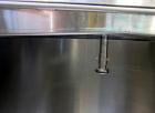 Used Tank, 1000 Gallon, 304 Stainless Steel, Vertical. Approximate 61” diameter x 81” straight side, flat top with a bolt on cover with a 1/3 hinged opening, sloped bottom. Side bottom entering agita...