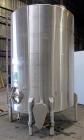 Used Tank, 2225 Gallon, 304 Stainless Steel, Vertical. Approximate 79” diameter x 105” straight side, flat welded top, sloped bottom. Side bottom entering agitator, 3 blade prop driven by a 5hp, 3/60...