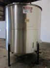 Used Tank, 1100 Gallon, 304 Stainless Steel, Vertical. Approximately 68” diameter x 70” straight side, flat top with (2) 1/3 hinged covers, coned bottom. Fixed stainless steel agitator bridge. Approx...
