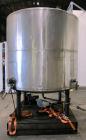 Used Tank, 1100 Gallon, 304 Stainless Steel, Vertical. Approximately 72” diameter x 60” straight side, dished top and bottom. Side bottom entering agitator with a 3 blade prop, driven by a 3/4 hp, 3/...
