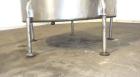 Used Tank, 1050 Gallons, 304 Stainless Steel, Vertical.  Approximately 62” diameter x 82” straight side.  Flat top, sloped bottom.  Off-center top entering Lightnin agitator, model N33G-150.  1-1/2” ...