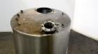 Used Tank, 1050 Gallons, 304 Stainless Steel, Vertical.  Approximately 62” diameter x 82” straight side.  Flat top, sloped bottom.  Off-center top entering Lightnin agitator, model N33G-150.  1-1/2” ...