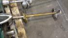 Used Tank, 1050 Gallons, 304 Stainless Steel, Vertical.  Approximately 62” diameter x 82” straight side.  Flat top, sloped bottom.  Off-center top entering Lightnin agitator, model N33G-150.  1-1/2” ...