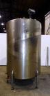 Used Tank, 1050 Gallon, 304 Stainless Steel, Vertical.  Approximately 62” diameter x 82” straight side.  Dished top, sloped bottom.  Off-center top entering Lightnin agitator, model N33G-150.  1-1/2”...