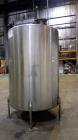 Used- Tank, 1050 Gallon, 304 Stainless Steel, Vertical.  Approximately 62” diameter x 82” straight side.  Dished top, sloped...