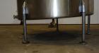 Used Tank, 1050 Gallon, 304 Stainless Steel, Vertical.  Approximately 62” diameter x 82” straight side.  Dished top, sloped bottom.  Off-center top entering Lightnin agitator, model N33G-150.  1-1/2”...