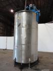 Used Tank, 3400 Gallon, 304 Stainless Steel, Vertical. Approximate 84” diameter x 143” straight side, flat top with 1/3 hinged cover, sloped bottom. Fixed carbon steel agitator bridge with a top ente...