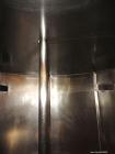 Used Tank, 3400 Gallon, 304 Stainless Steel, Vertical. Approximate 84” diameter x 143” straight side, flat top with 1/3 hinged cover, sloped bottom. Fixed carbon steel agitator bridge with a top ente...