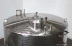 Used Vinquip Jacketed Beverage Tank,  2284 Gallon, 304 Stainless Steel, Vertical. Approximately 83” diameter x 97-1/2” straight side, off center coned top, sloped bottom. (1) 24” Wide bottom sidewall...