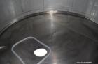 Used Vinquip Jacketed Beverage Tank,  2284 Gallon, 304 Stainless Steel, Vertical. Approximately 83” diameter x 97-1/2” straight side, off center coned top, sloped bottom. (1) 24” Wide bottom sidewall...
