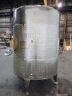 Used Vinquip Jacketed Beverage Tank,  2284 Gallon, 304 Stainless Steel, Vertical. Approximately 83” diameter x 97-1/2” straight side, off center coned top, sloped bottom. (1) 24” Wide bottom sidewall...