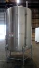 Used Tank, 1000 Gallon, 304 Stainless Steel, Vertical. 60” Diameter x 82” straight side, flat welded top, sloped bottom. Side Bottom entering agitator with a 3 blade prop, driven by a 3hp, 3/60/230/4...
