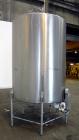 Used- Tank, 1000 Gallon, 304 Stainless Steel, Vertical. 60” Diameter x 82” straight side, flat welded top, sloped bottom. Si...