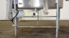 Used Tank, 1000 Gallon, 304 Stainless Steel, Vertical. 60” Diameter x 82” straight side, flat welded top, sloped bottom. Side Bottom entering agitator with a 3 blade prop, driven by a 3hp, 3/60/230/4...