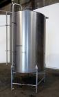 Used Tank, 1000 Gallon, 304 Stainless Steel, Vertical. 60” Diameter x 82” straight side, flat welded top, sloped bottom. Side Bottom entering agitator with a 3 blade prop, driven by a 2hp, 3/60/208-2...