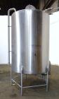 Used Tank, 1000 Gallon, 304 Stainless Steel, Vertical. 60” Diameter x 82” straight side, flat welded top, sloped bottom. Side Bottom entering agitator with a 3 blade prop, driven by a 2hp, 3/60/208-2...