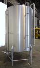 Used- Tank, 1000 Gallon, 304 Stainless Steel, Vertical. 60” Diameter x 82” straight side, flat welded top, sloped bottom. Si...