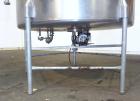 Used Tank, 1000 Gallon, 304 Stainless Steel, Vertical. 60” Diameter x 82” straight side, flat welded top, sloped bottom. Side Bottom entering agitator with a 3 blade prop, driven by a 2hp, 3/60/208-2...