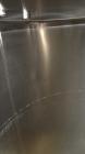 Used Tank, 1000 Gallon, 304 Stainless Steel, Vertical. 60” Diameter x 82” straight side, flat welded top, sloped bottom. Side Bottom entering agitator with a 3 blade prop, driven by a 2hp, 3/60/208-2...