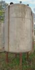 Used Tank, 1000 Gallon, stainless steel, vertical. Approximately 54