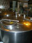 Used Norwalk Tank, 2000 Gallon,  stainless steel, vertical. 76