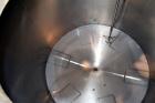 Used Perma-San Tank, 2000 Gallon, Model CVC, 316 Stainless Steel Vertical. 84” Diameter x 80” straight side. Dished top, coned bottom. Off center top entering Lightnin air operated agitator, model XJ...