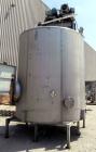 Used Walker Stainless Tank, 4700 Gallon, 304 Stainless Steel, Vertical. Approximate 108” diameter x 120” straight side, coned top, flat bottom. Top entering agitator, with an anchor style blade with ...
