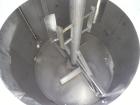Used Walker Stainless Tank, 4700 Gallon, 304 Stainless Steel, Vertical. Approximate 108” diameter x 120” straight side, coned top, flat bottom. Top entering agitator, with an anchor style blade with ...
