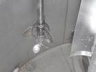 Used Walker Stainless Tank, 4700 Gallon, 304 Stainless Steel, Vertical. Approximate 108” diameter x 120” straight side, coned top, flat bottom. Top entering agitator, with an anchor style blade with ...