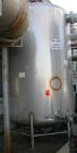 USED: Walker 4,800 gallon, type 304L stainless steel, storage tank. Vertical, dished heads. Approximate 8' diameter x 12' straight side. Misc top and side flanged openings. Side openings include a 16...