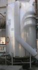 USED: Walker 4,800 gallon, type 304L stainless steel, storage tank. Vertical, dished heads. Approximate 8' diameter x 12' straight side. Misc top and side flanged openings. Side openings include a 16...
