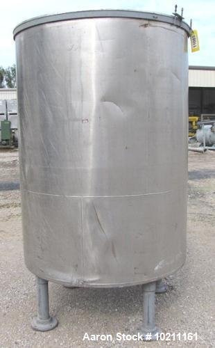 Used Tank, Approximately 700 Gallons, Stainless Steel.  54" Diameter x 72" straight side.  Open top (no cover), dish bottom.  3" NPT center bottom outlet.  Mounted on 4 pipe threaded legs.