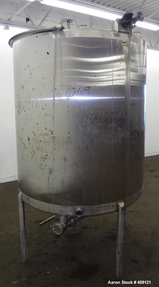 Used Tank, 575 Gallons, 304 Stainless Steel, Vertical, Approximately 55" Diameter X 58" Straight Side. Flat Top and Sloped Bottom. Top opening Lightnin Agitator model V5P18, serial number 93B65575, a...