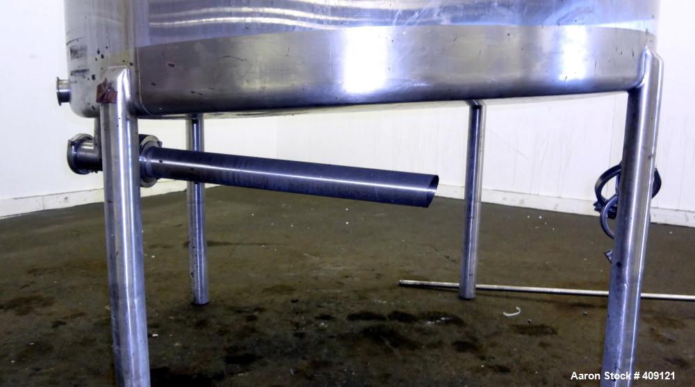 Used Tank, 575 Gallons, 304 Stainless Steel, Vertical, Approximately 55" Diameter X 58" Straight Side. Flat Top and Sloped Bottom. Top opening Lightnin Agitator model V5P18, serial number 93B65575, a...