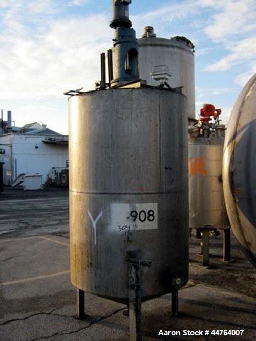 Used Tank, 550 Gallon, 304 Stainless Steel, Vertical.  48” Diameter x 72” straight side, flat top, 25” coned bottom.  Top entering agitator, driven by a 3 hp motor. Center bottom outlet.  Mounted on ...