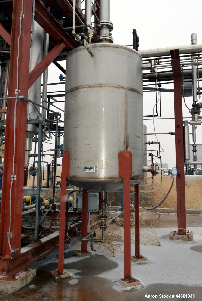 Used Par Piping & Fabrication Tank, 600 Gallon, 321 Stainless Steel, Vertical. 48" Diameter x 72" straight side, dished top and bottom. Openings top 3", 8"; side 2", 3". 1" Center bottom outlet. Moun...