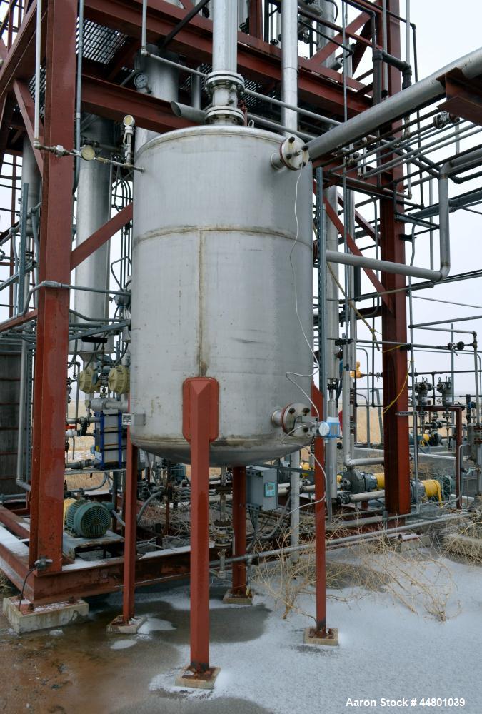 Used Par Piping & Fabrication Tank, 600 Gallon, 321 Stainless Steel, Vertical. 48" Diameter x 72" straight side, dished top and bottom. Openings top 3", 8"; side 2", 3". 1" Center bottom outlet. Moun...